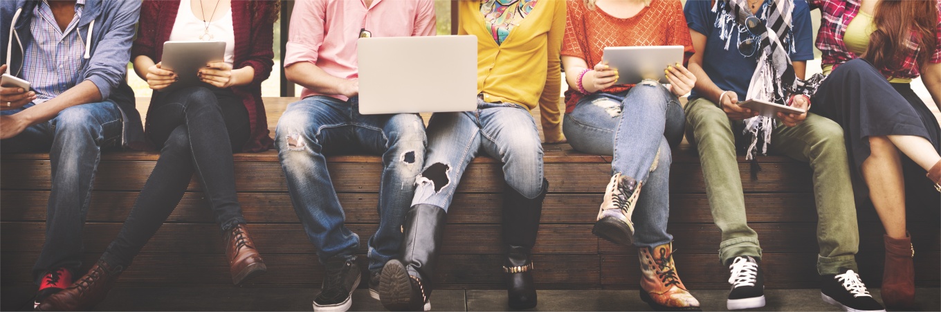 A row of students holding mobile devices