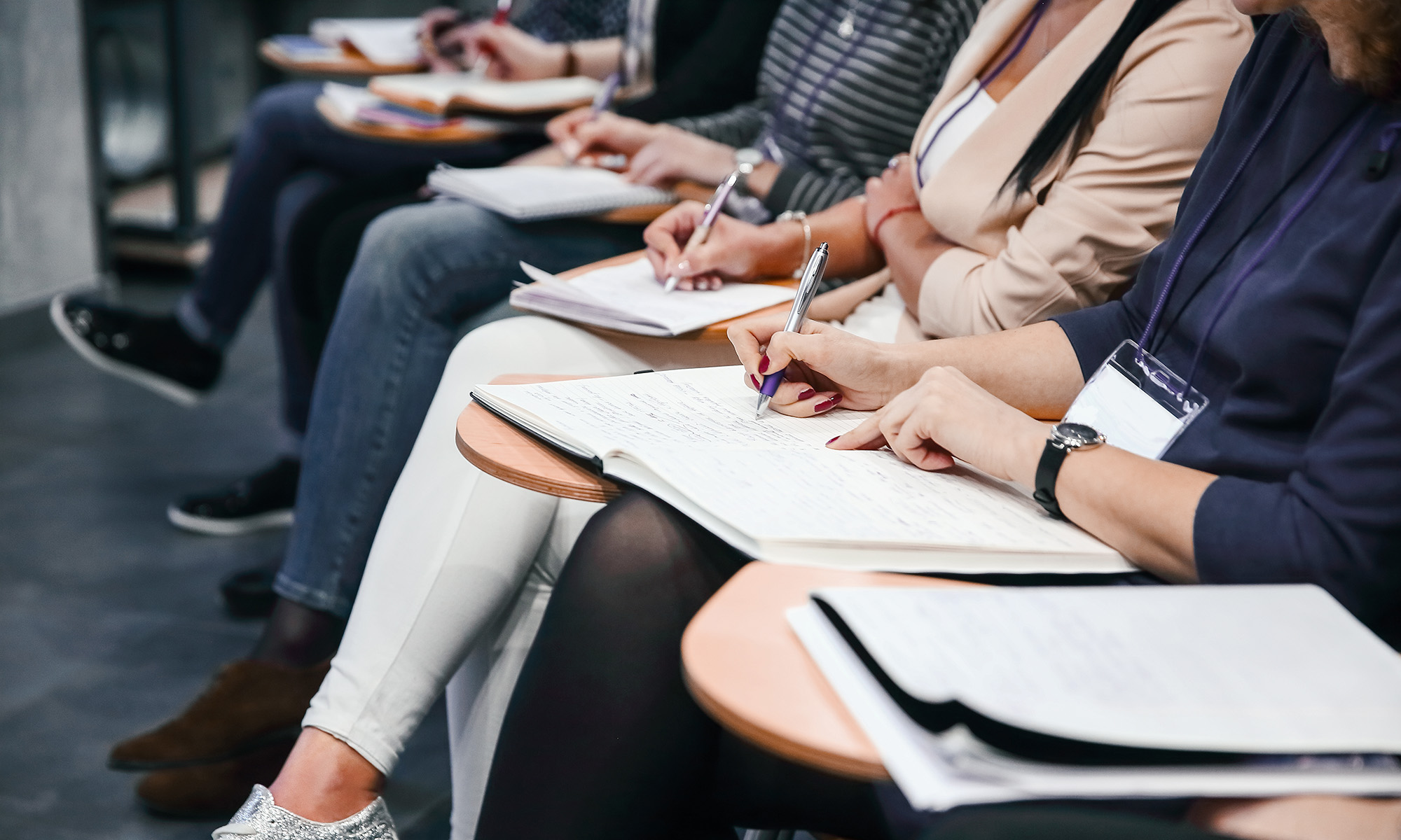 Participants taking notes at a workshop