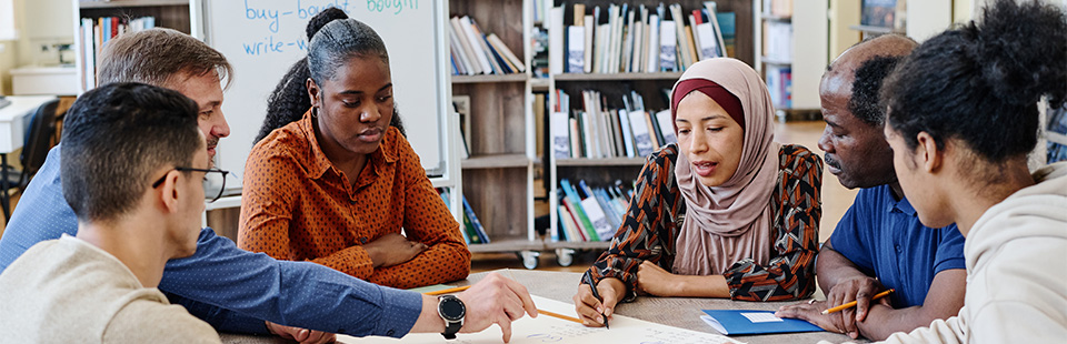 Teacher working with students